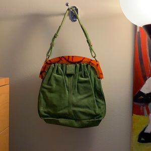 Lucky Brand green suede bag, plastic top, magnetic closure.